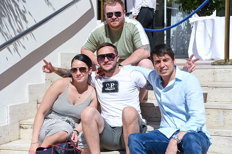 4 good colleagues sitting in a step