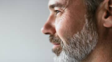 Senior consultant with beard looking self assured
