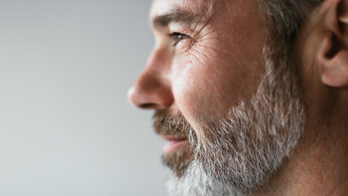 Senior consultant with beard looking self assured