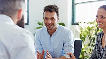 A consultant in an interview with two people representing the client