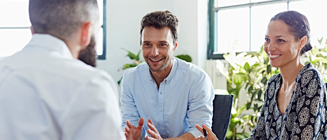 A consultant in an interview with two people representing the client