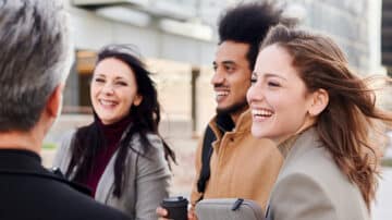 IT professionals outside engaging in conversation