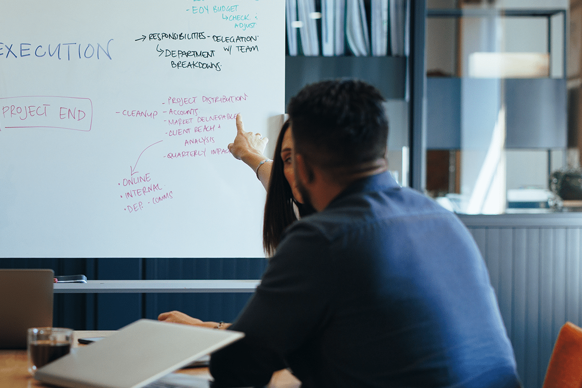 Business people asking questions during a meeting.