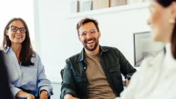 thre people in a amicable meeting